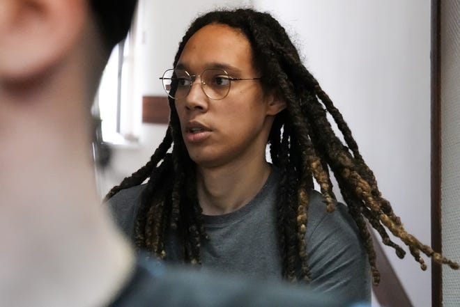 WNBA star and two-time Olympic gold medalist Brittney Griner is escorted to a courtroom for a hearing in Khimki just outside Moscow, Russia, Monday, June 27, 2022. More than four months after she was arrested at a Moscow airport for cannabis possession, American basketball star Brittney Griner appeared in court Monday for a preliminary hearing ahead of her trial.
