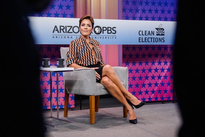 Kari Lake poses for photos before a debate with Republican candidates ahead of the Aug. 2 primary election for the Arizona governor's office on Wednesday, June 29, 2022, in Phoenix.