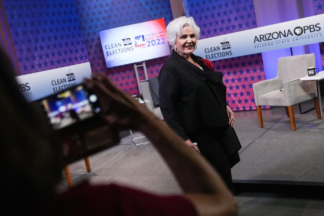 Paola Tulliani Zen poses for photos before a debate with Republican candidates ahead of the Aug. 2 primary election for the Arizona governor's office in Phoenix.
