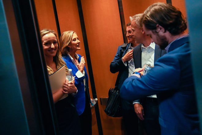 Karrin Taylor Robson (center left) gets into an elevator with her staff after a debate with Republican candidates ahead of the Aug. 2 primary election for the Arizona governor's office on Wednesday, June 29, 2022, in Phoenix.