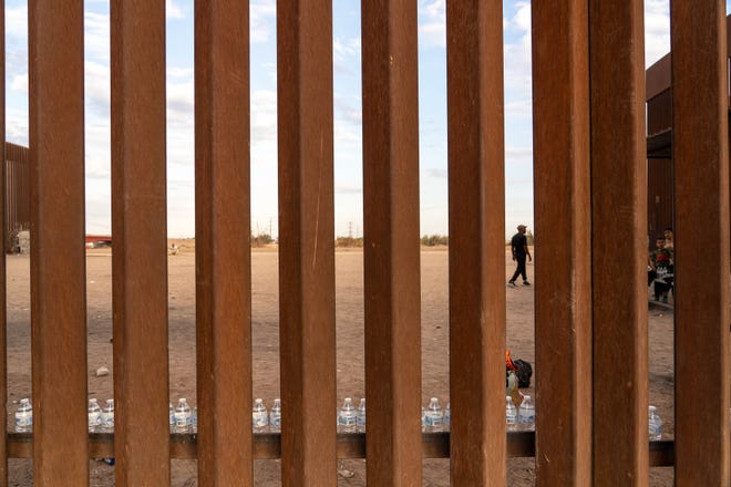 Water bottles placed by volunteers from the AZ-CA Humanitarian Coalition sit along the U.S.-Mexico border for migrants and asylum seekers in San Luis, Arizona, on July 28, 2022.
