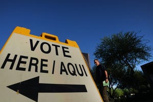 Voters enter the polling station at the Phoenix Art Museum on Aug. 2, 2022, to vote in the primary election.