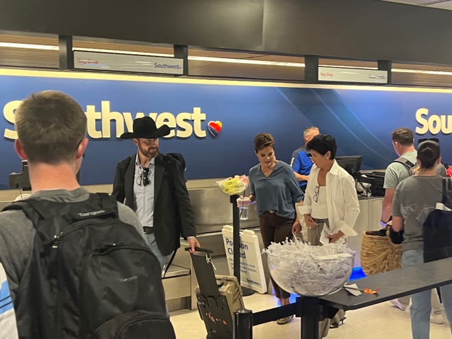 Arizona gubernatorial candidate Kari Lake is seen at Sky Harbor Airport after heavy rains stopped flights for several hours on Aug. 4, 2022. Arizona primary 2022: Live primary updates | Arizona election results