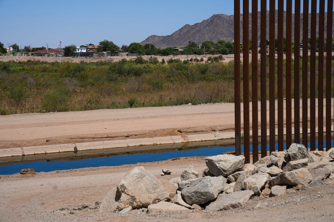 A gap in the border wall at the Morelos Dam on Aug. 10, 2022, in Yuma.