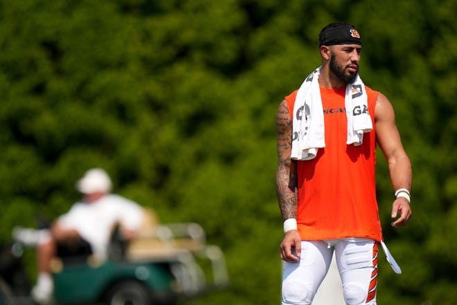 Cincinnati Bengals safety Jessie Bates III (30), who returned to practice after signing his franchise tender, works on the field as Cincinnati Bengals President Mike Brown, background, observes a joint practice with the Los Angeles Rams, Wednesday, Aug. 24, 2022, at the Paycor Stadium practice fields in Cincinnati.