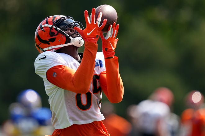 Cincinnati Bengals wide receiver Tee Higgins (85) completes a deep pass down the sideline during a joint practice with the Los Angeles Rams, Wednesday, Aug. 24, 2022, at the Paycor Stadium practice fields in Cincinnati.