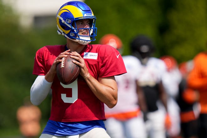Los Angeles Rams quarterback Matthew Stafford (9) drops back to pass during a joint practice with the Cincinnati Bengals, Wednesday, Aug. 24, 2022, at the Paycor Stadium practice fields in Cincinnati.