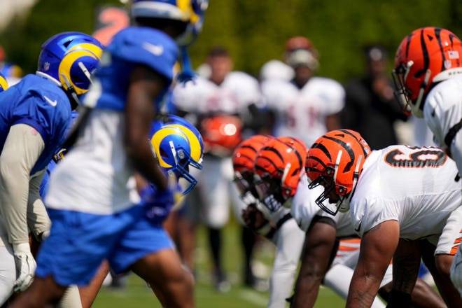 The Los Angeles Rams offensive line and the Cincinnati Bengals defensive line line up for a drill during a joint practice, Wednesday, Aug. 24, 2022, at the Paycor Stadium practice fields in Cincinnati.