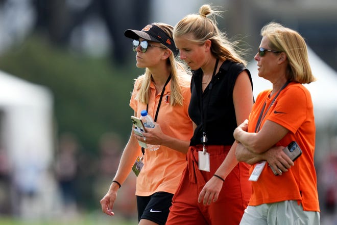 Elizabeth Blackburn, director of strategy & engagement, far left, walks with Caroline Blackburn, senior manager of digital strategy and Katie Blackburn, executive vice president, at the conclusion of  a joint practice with the Los Angeles Rams, Wednesday, Aug. 24, 2022, at the Paycor Stadium practice fields in Cincinnati.
