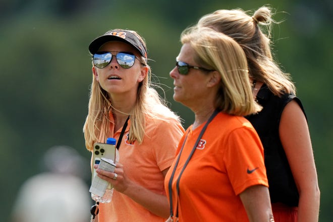 Elizabeth Blackburn, director of strategy & engagement, far left, walks with Caroline Blackburn, senior manager of digital strategy and Katie Blackburn, executive Vice President, at the conclusion of  a joint practice with the Los Angeles Rams, Wednesday, Aug. 24, 2022, at the Paycor Stadium practice fields in Cincinnati.