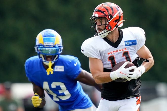 Cincinnati Bengals wide receiver Trent Taylor (11) turns downfield after completing a catch as Los Angeles Rams safety Russ Yeast II (43) defends during a joint practice, Wednesday, Aug. 24, 2022, at the Paycor Stadium practice fields in Cincinnati.