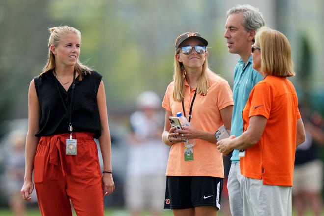From Left: Caroline Blackburn, senior manager of digital strategy, Elizabeth Blackburn, director of strategy & engagement and Katie Blackburn, executive vice president, far right, talk during a joint joint practice with the Los Angeles Rams, Wednesday, Aug. 24, 2022, at the Paycor Stadium practice fields in Cincinnati.