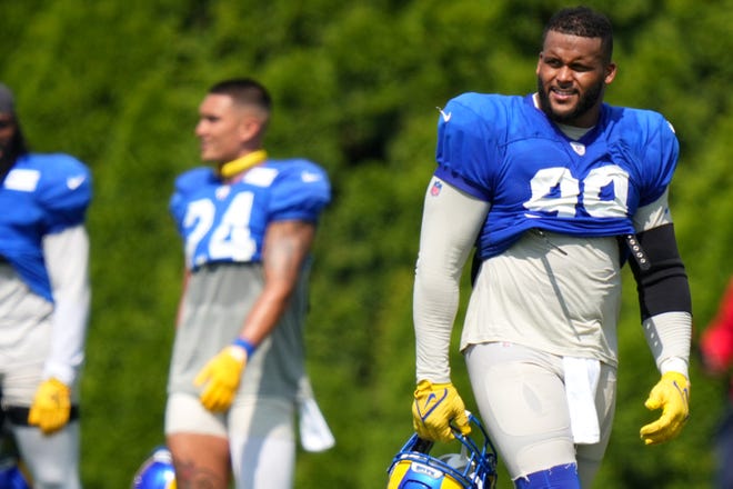 Los Angeles Rams defensive tackle Aaron Donald (99) looks out onto the field during a joint practice with the Cincinnati Bengals, Wednesday, Aug. 24, 2022, at the Paycor Stadium practice fields in Cincinnati.