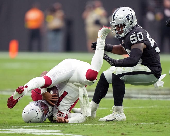 Kyler Murray #1 of the Arizona Cardinals flips on the ground against Jayon Brown #50 of the Las Vegas Raiders in the second half at Allegiant Stadium on Sept. 18, 2022, in Las Vegas, Nevada.