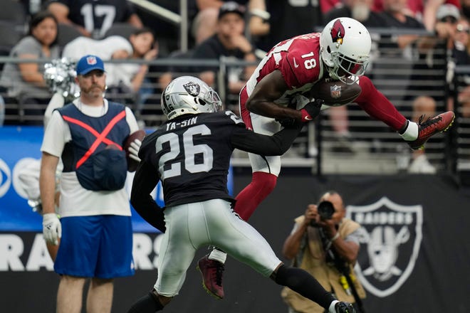 Arizona Cardinals wide receiver A.J. Green (18) misses on a catch attempt over Las Vegas Raiders cornerback Rock Ya-Sin (26) during the second half of an NFL football game Sunday, Sept. 18, 2022, in Las Vegas.