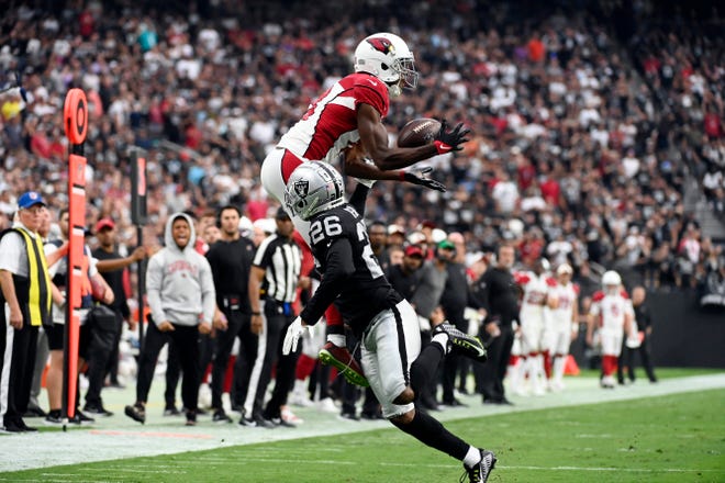 Arizona Cardinals wide receiver A.J. Green, tp, leaps but cannot catch a pass over Las Vegas Raiders cornerback Rock Ya-Sin (26) during the second half of an NFL football game Sunday, Sept. 18, 2022, in Las Vegas.