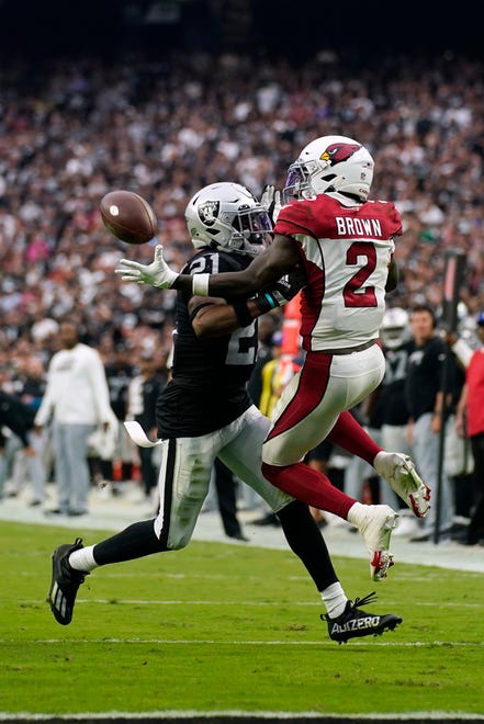 Arizona Cardinals wide receiver Marquise Brown (2) makes a catch in front of Las Vegas Raiders cornerback Amik Robertson (21) during the second half of an NFL football game Sunday, Sept. 18, 2022, in Las Vegas.