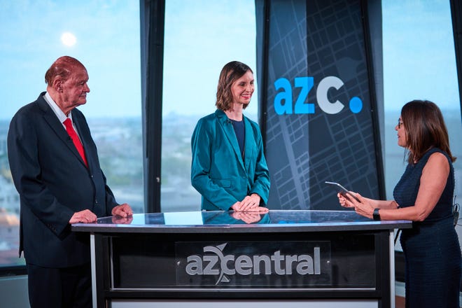 Candidates for  Arizona Superintendent of Public Instruction Tom Horne (R) (left) and Kathy Hoffman (D) (middle) participate in a debate moderated by Elvia Diaz, the editor page senior director to The Arizona Republic, in The Republic's studio on Sept. 28, 2022, in Phoenix.