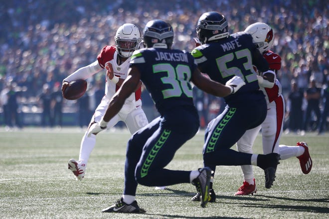 Kyler Murray #1 of the Arizona Cardinals runs against the Seattle Seahawks during the first quarter at Lumen Field on October 16, 2022, in Seattle, Washington.