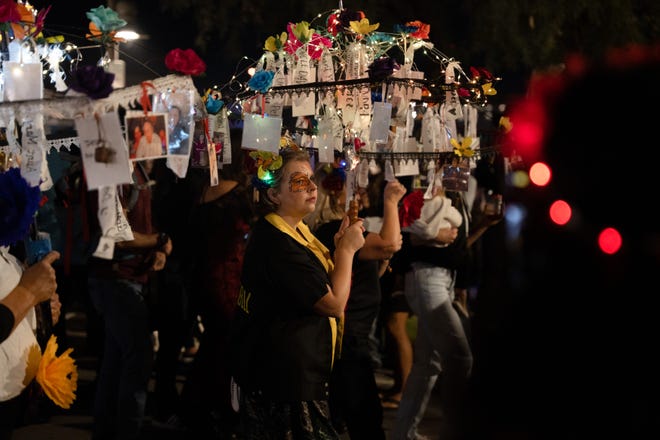 Cassie Williams walks at the 33rd Annual All Souls Procession in Tucson on Nov. 6, 2022. The procession is not a Day of the Dead-themed celebration, but an opportunity for community members to honor the dead through any tradition, said event parent organization and nonprofit Many Mouths One Stomach.