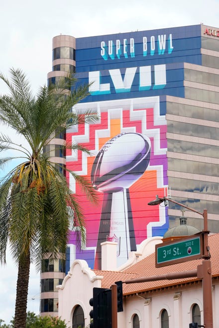 Super Bowl LVII signage covers a high-rise building behind St. Mary's Basilica in downtown Phoenix on Jan. 30, 2023.