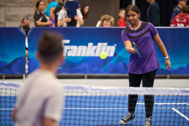 Devyn Toppin, 12, plays a game of pickleball during the Super Bowl Experience at the Phoenix Convention Center on Feb. 5, 2023.