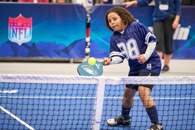 Amari Shepard, 11, plays a game of pickleball during the Super Bowl Experience at the Phoenix Convention Center on Feb. 5, 2023.