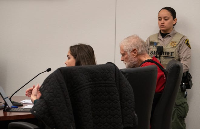 George Alan Kelly (center) listens to his attorney Brenna Larkin (left) during his preliminary hearing on Feb. 22, 2023, in Nogales.