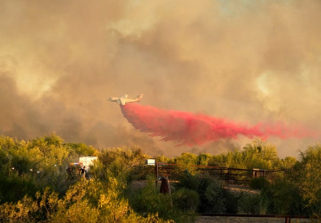 Fire retardant is dropped on the Diamond Fire burns south of Rio Verde Drive northeast of Scottsdale June 27, 2023.